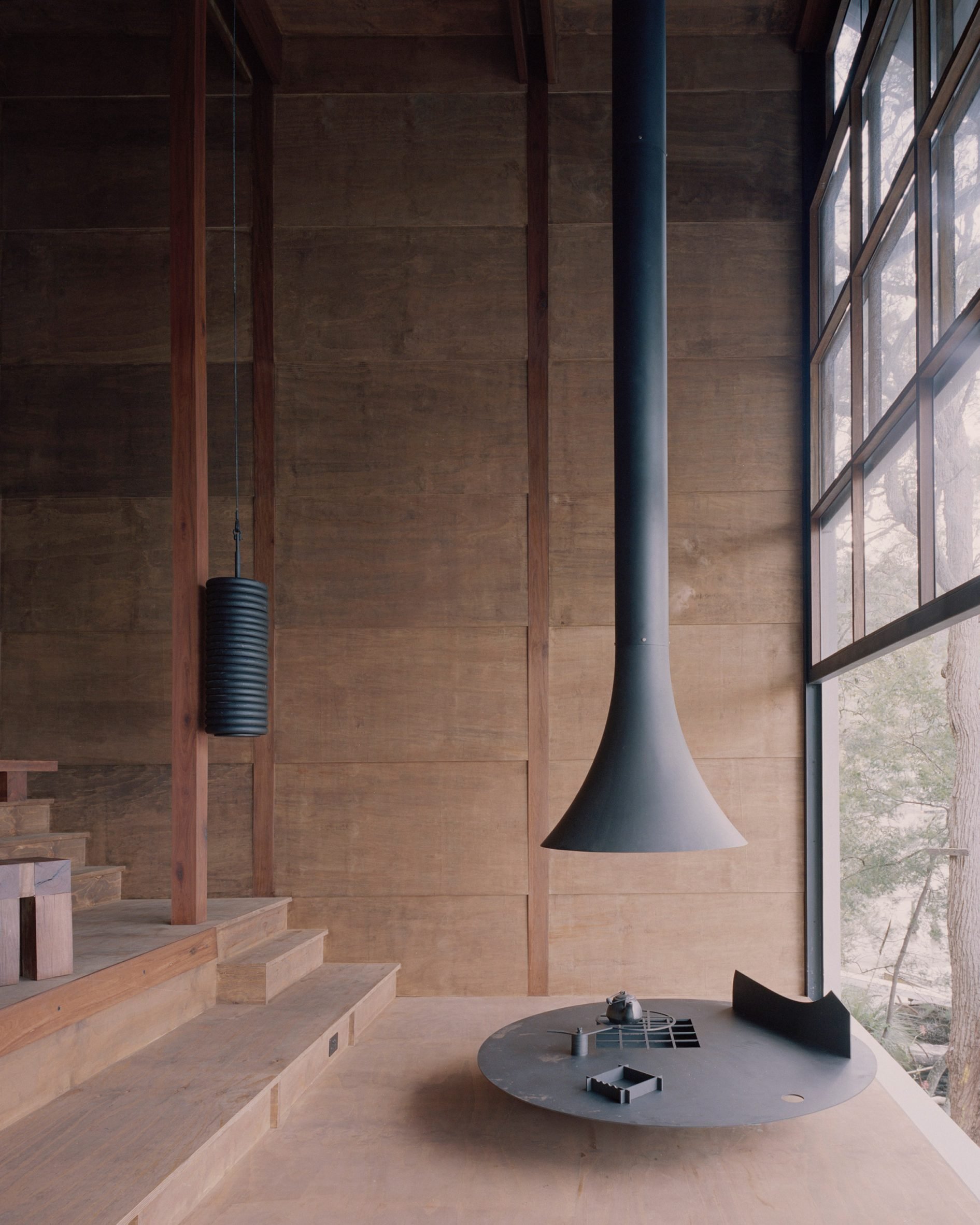 Suspended fireplace in a wooden living room