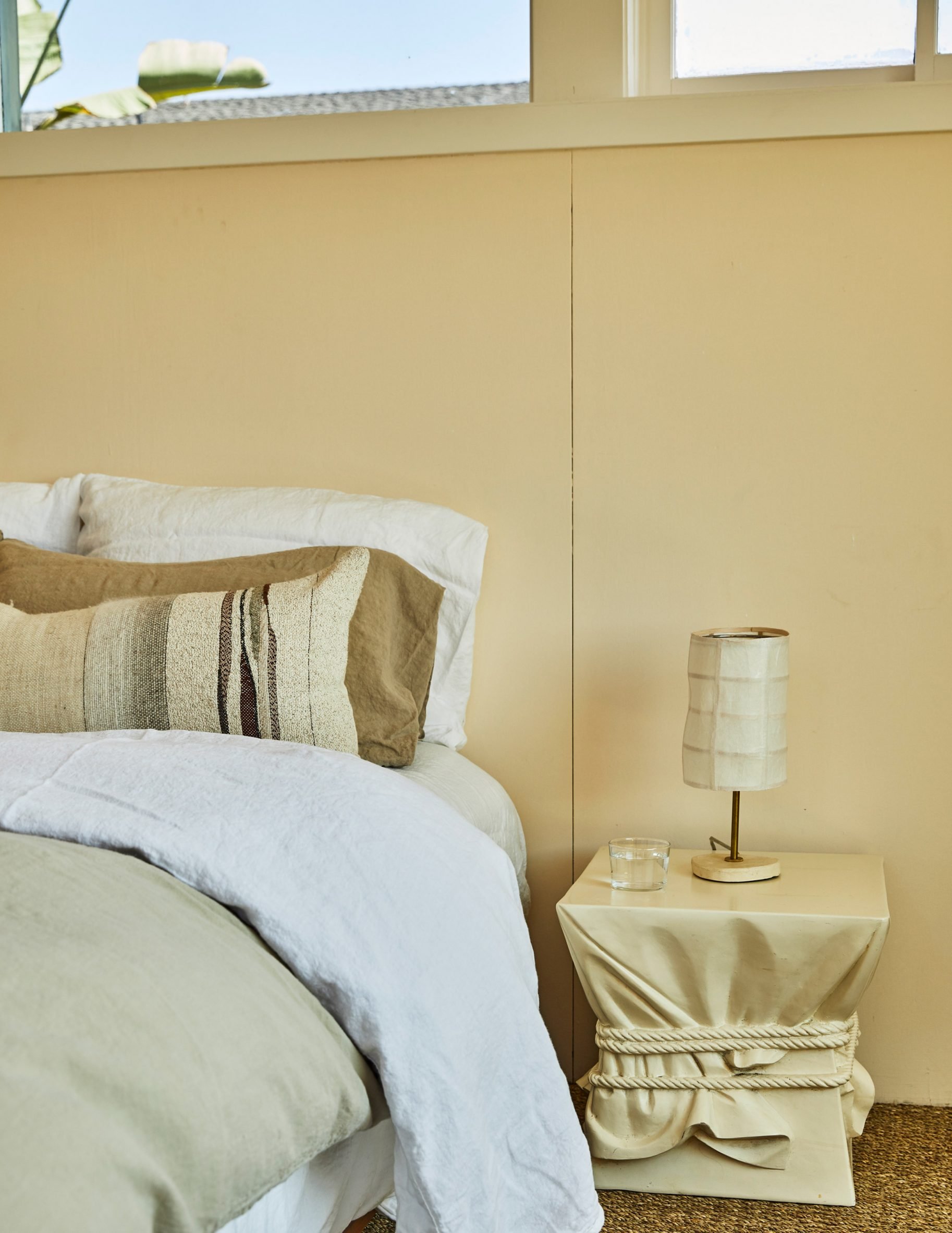 Butter-yellow wall complements the neutral tones