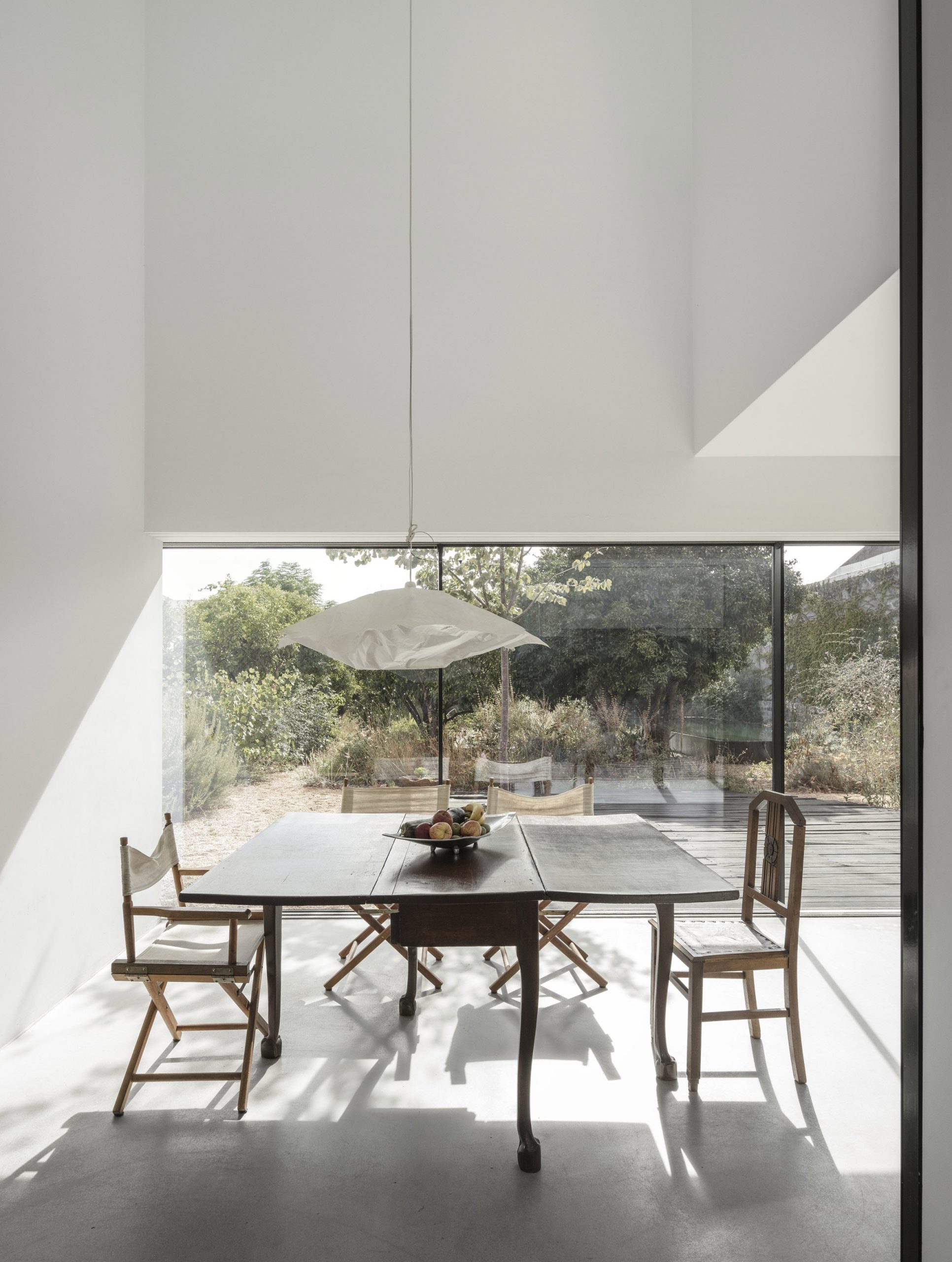 Mismatched seating inside Red House, Portugal, by Extrastudio