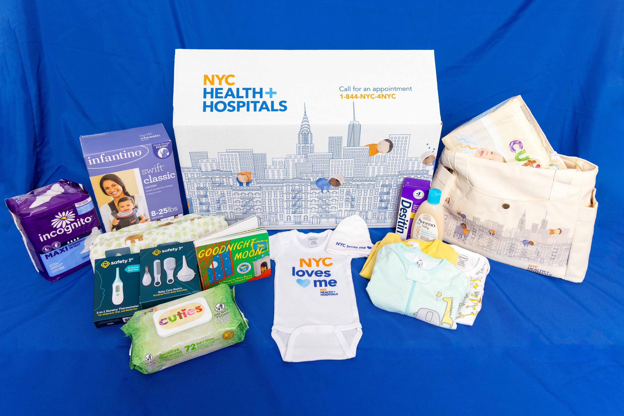 NYC Baby Box featuring nappies, wipes and a baby vest