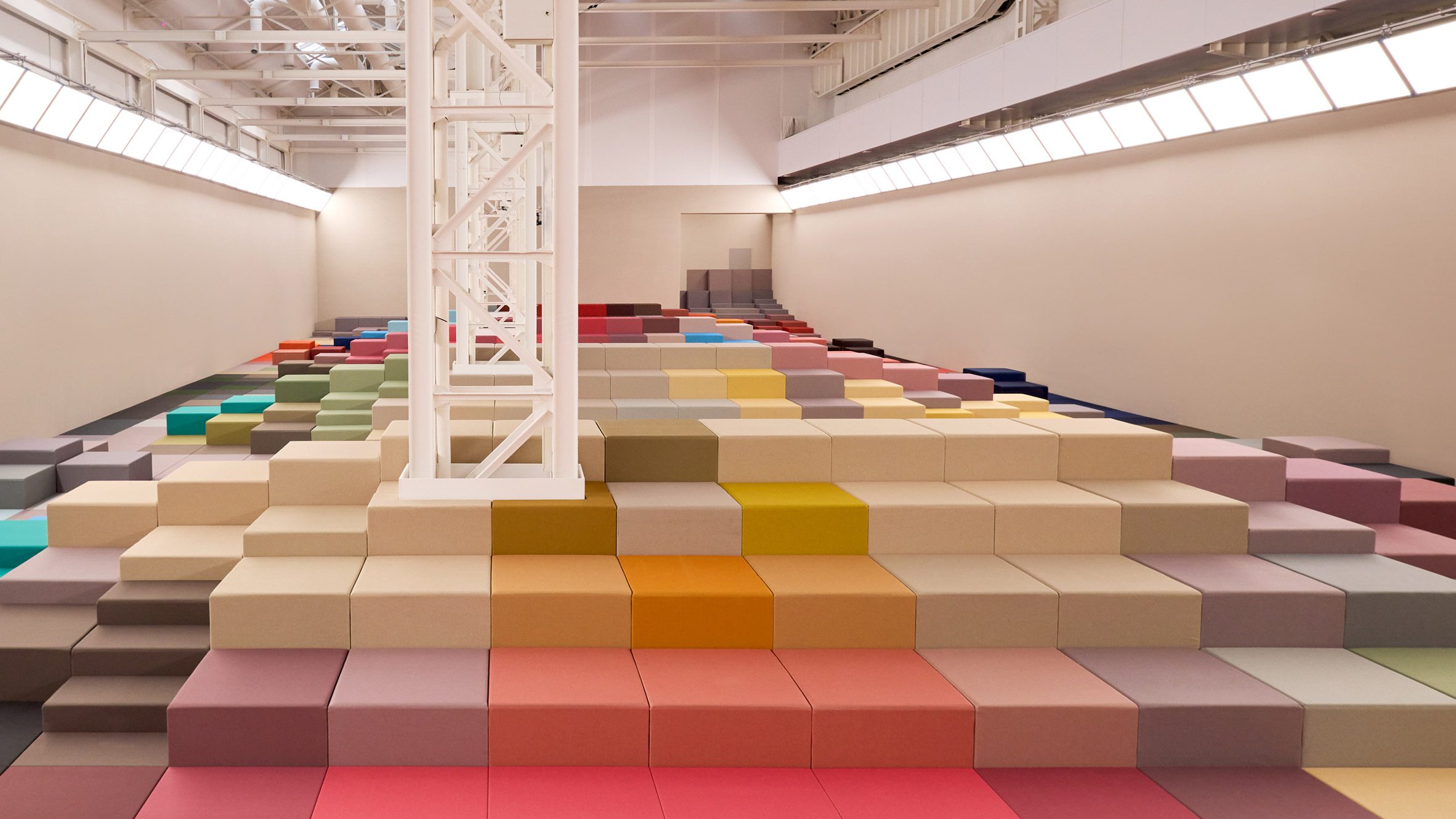 Colourful blocks forming seating in Marc Newson's runway set design for the Fendi SS26 show at Milan Fashion Week