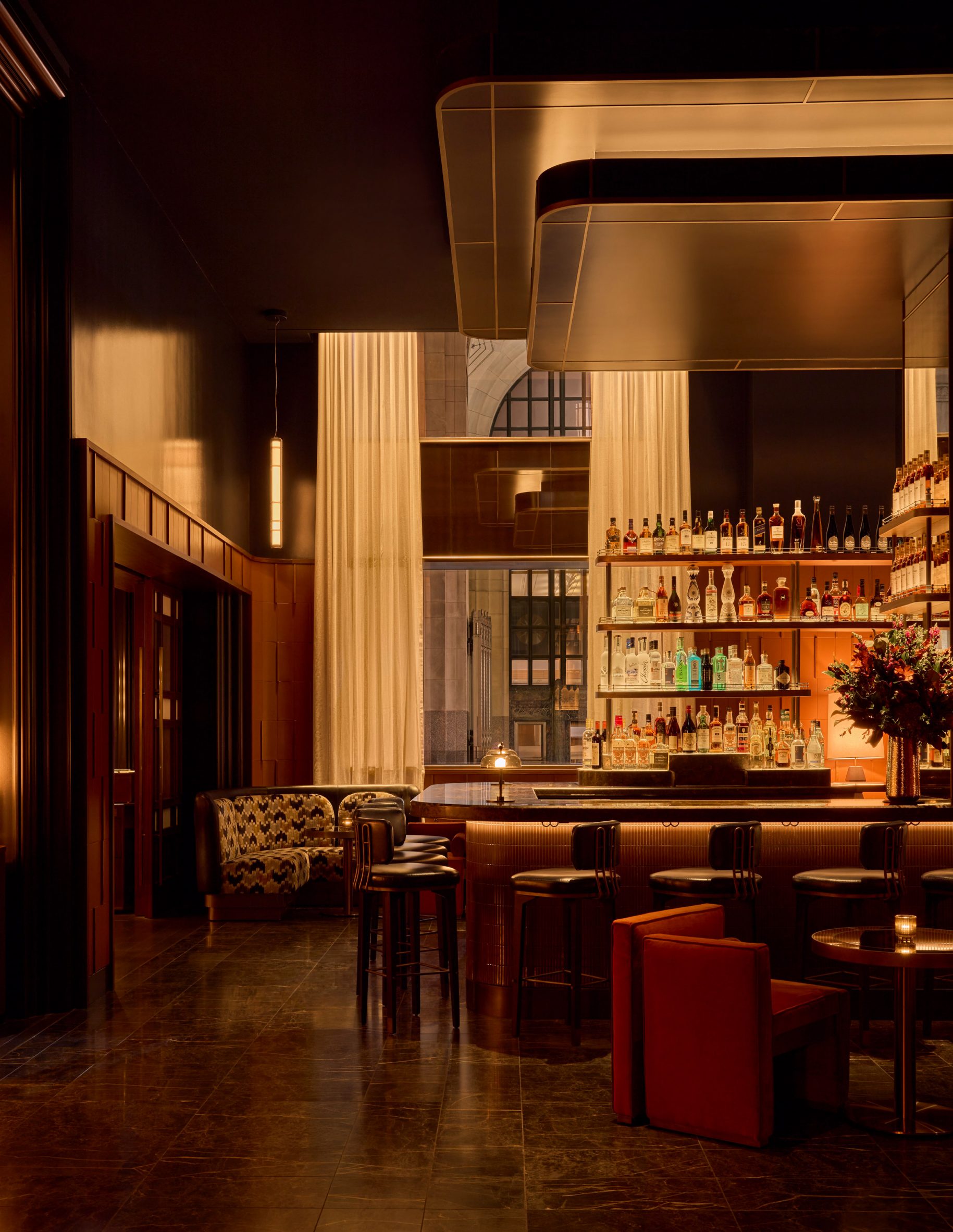 Bar area with tall ceiling and low lighting