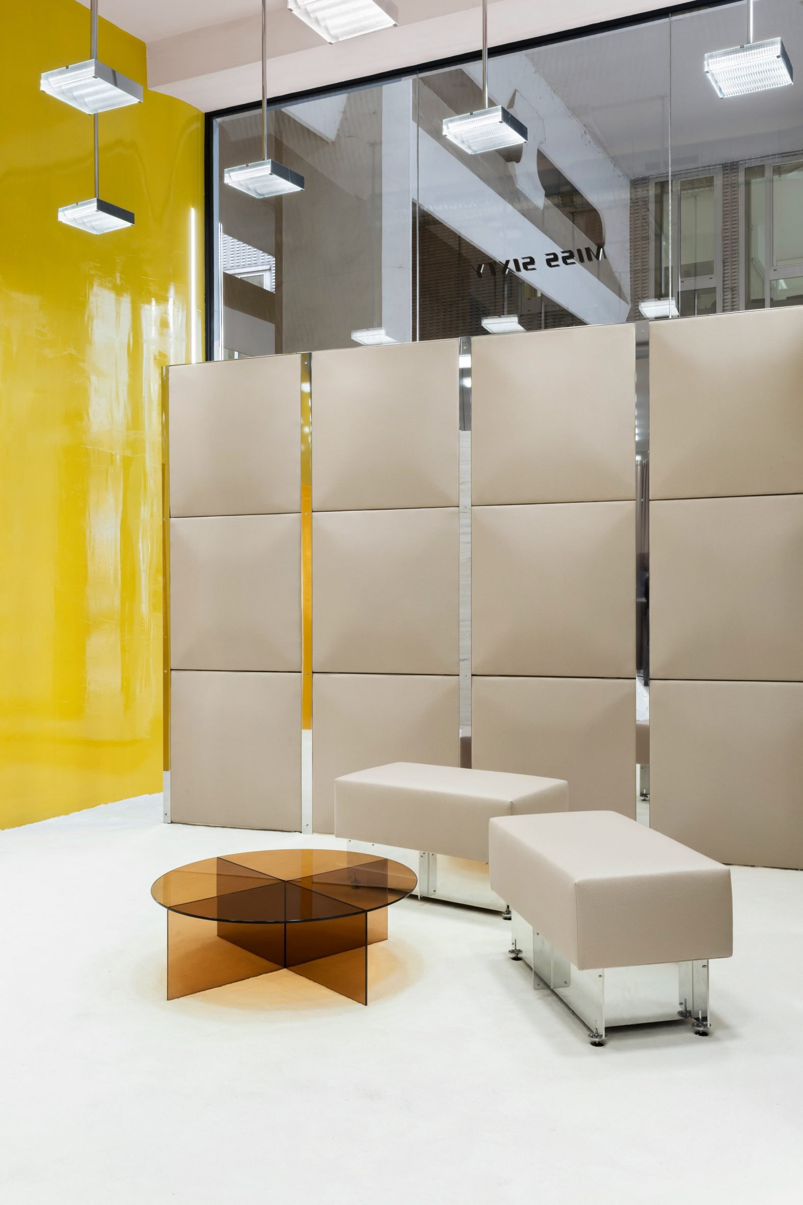 Bright yellow wall in fashion store