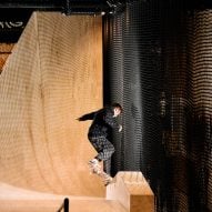 Man skating in Vans store