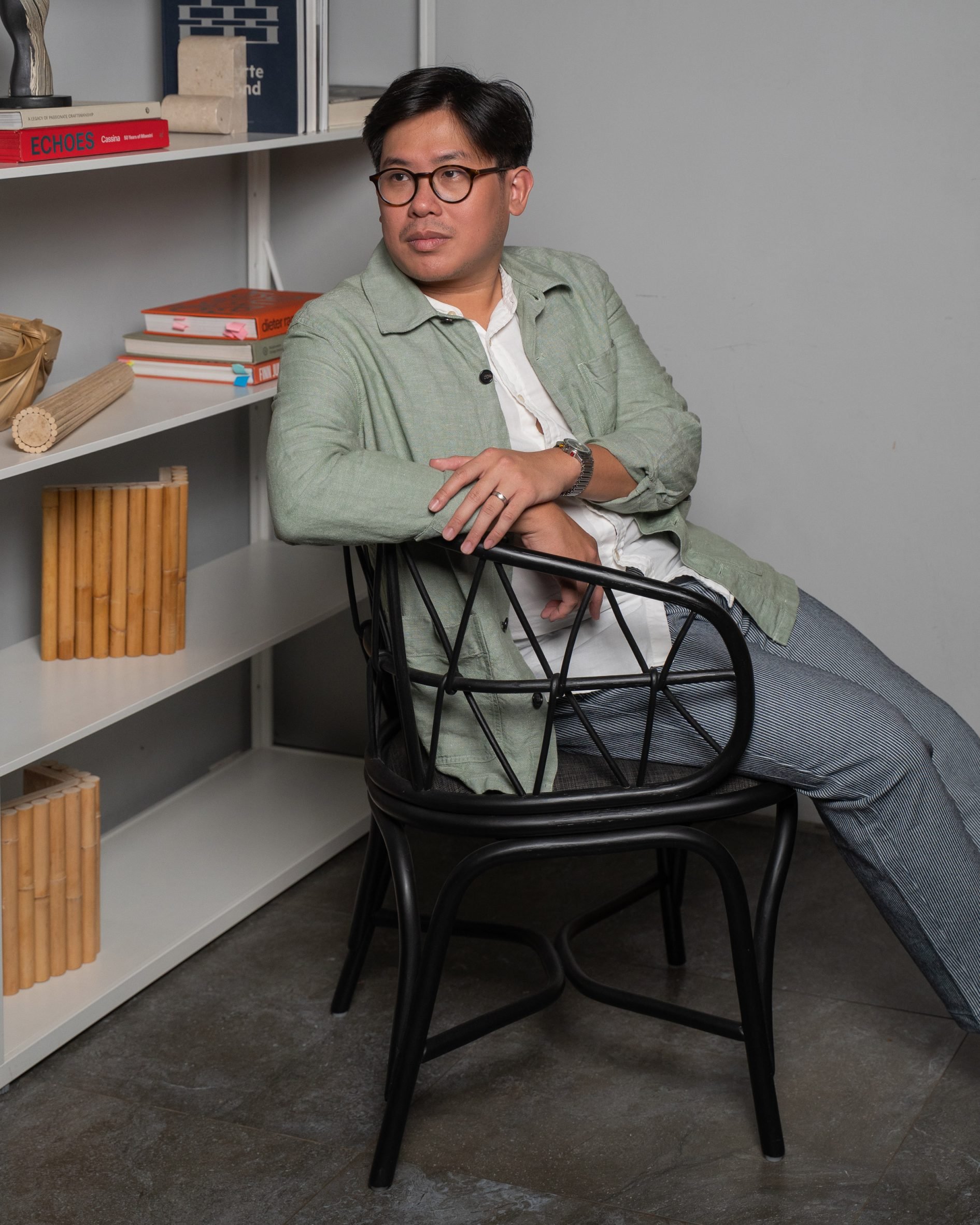 Felix Sidharta of Cassia sitting on Simpul rattan chair