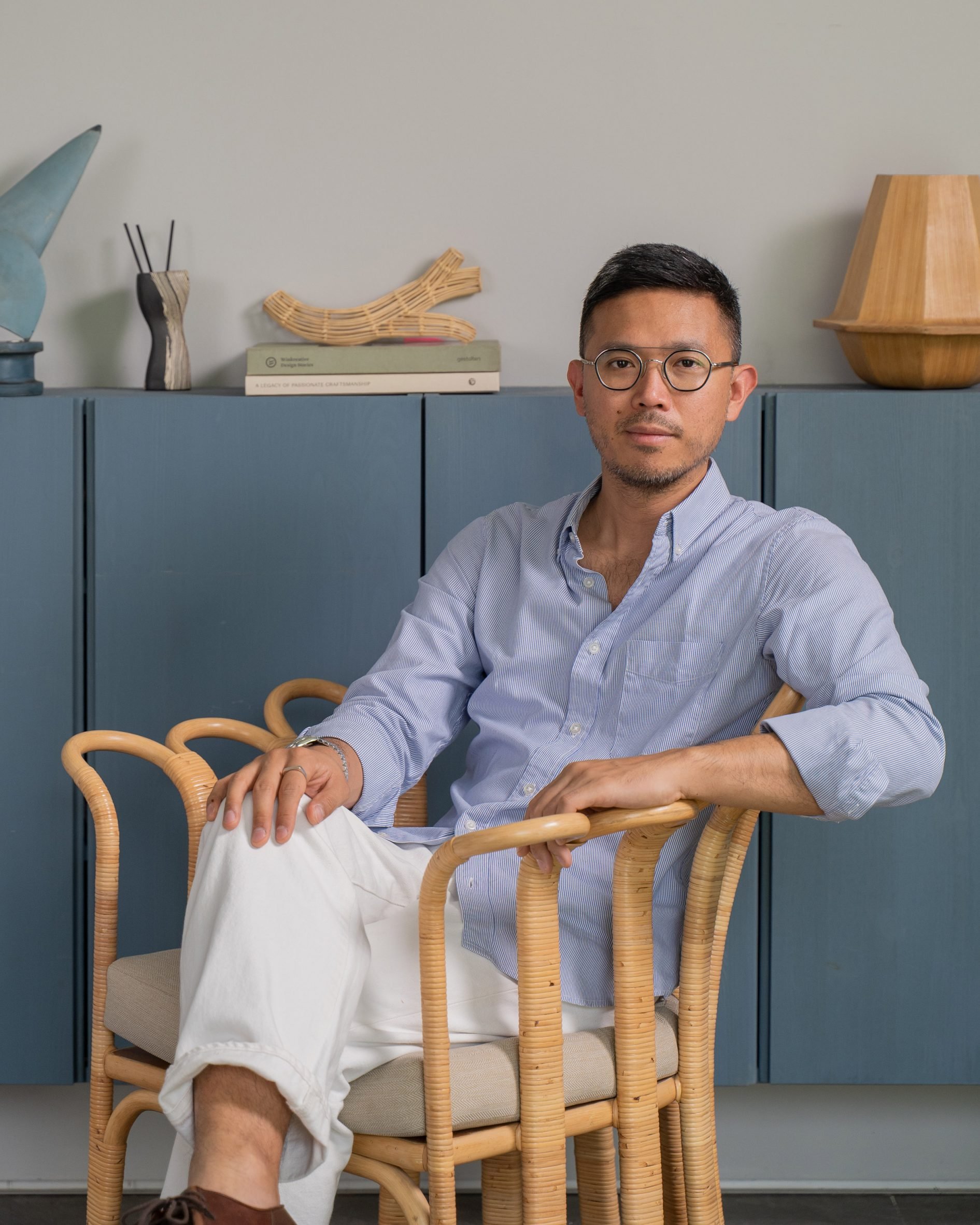 Alvin Tjitrowirjo sitting on rattan chair