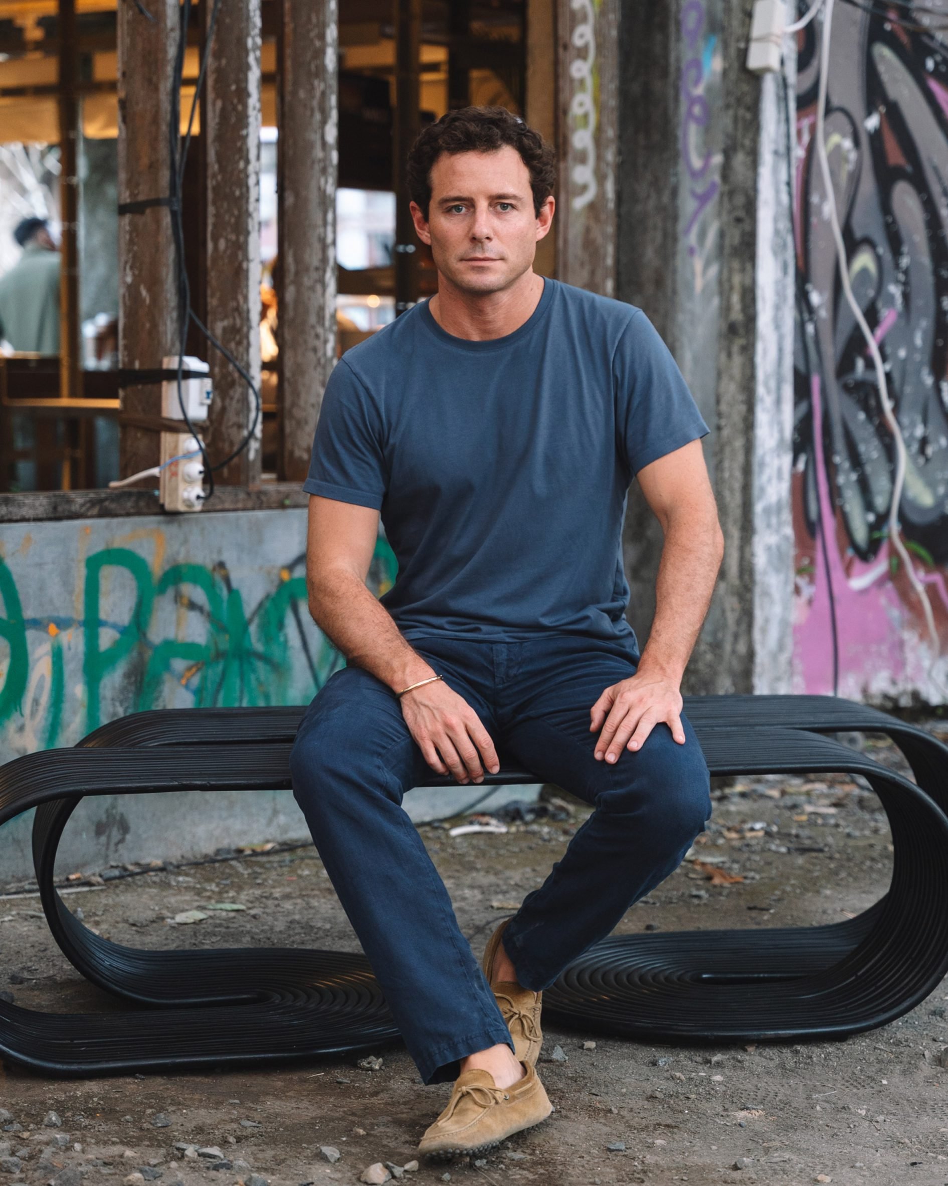 Pietro Franceschini sitting on Rotella rattan bench